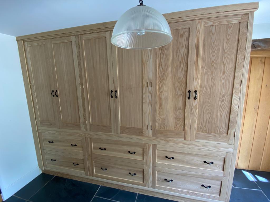 A recent ash storage unit we made. Solid wood doors and dovetailed drawers.