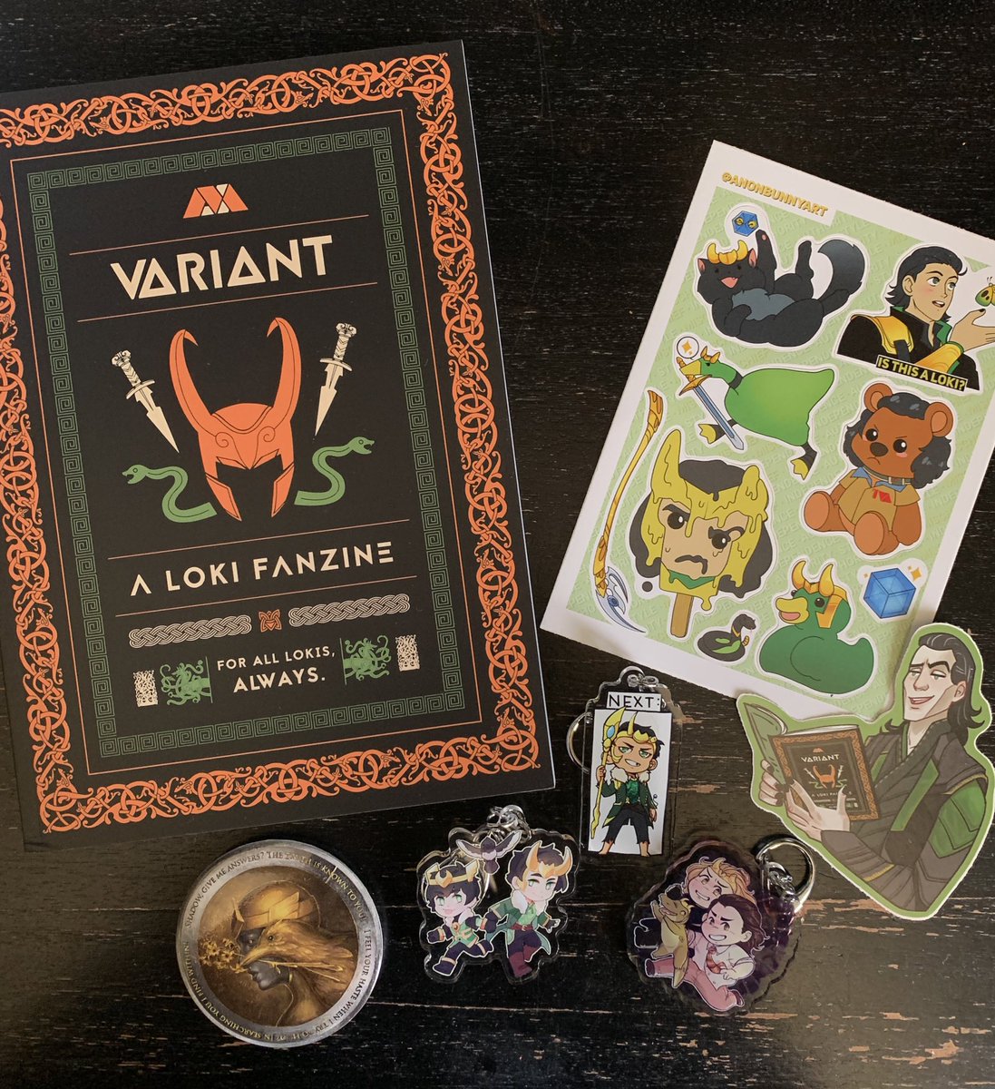WWOOHOOOO JUST GOT MY LOKI ZINE!! PLUS THE STICKERS???? my fav are the pin and the loki next keychain ;-; <3333 TYSMM FOR THE EXTRA STICKERS <a href="/VariantZine/">VARIANT | A Loki Fan Zine 🐍 ✨</a> !!!!!