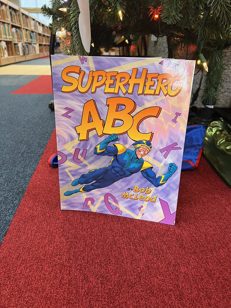 ashleymcveyMRS's tweet photo. A new feature in our library this year will be our monthly Storybook tree. September’s book is themed from Superhero ABC. @MillsRiverSch #THEplacetobe #heretofly https://t.co/SKE4RLsOmp