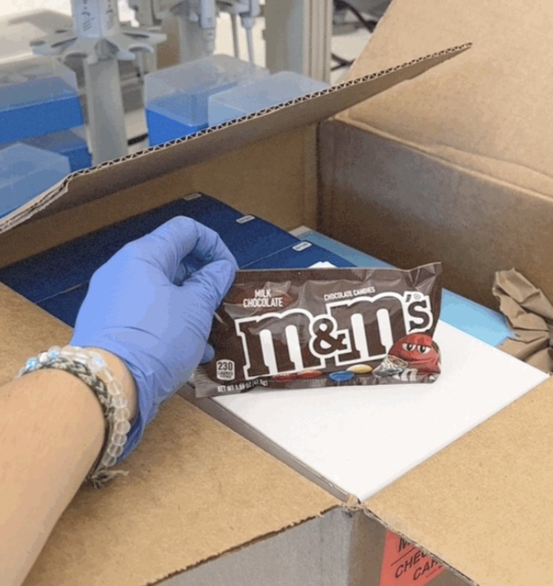 Unpacking the new lab with @THQazi — who knew pipettes came with M&amp;Ms?!