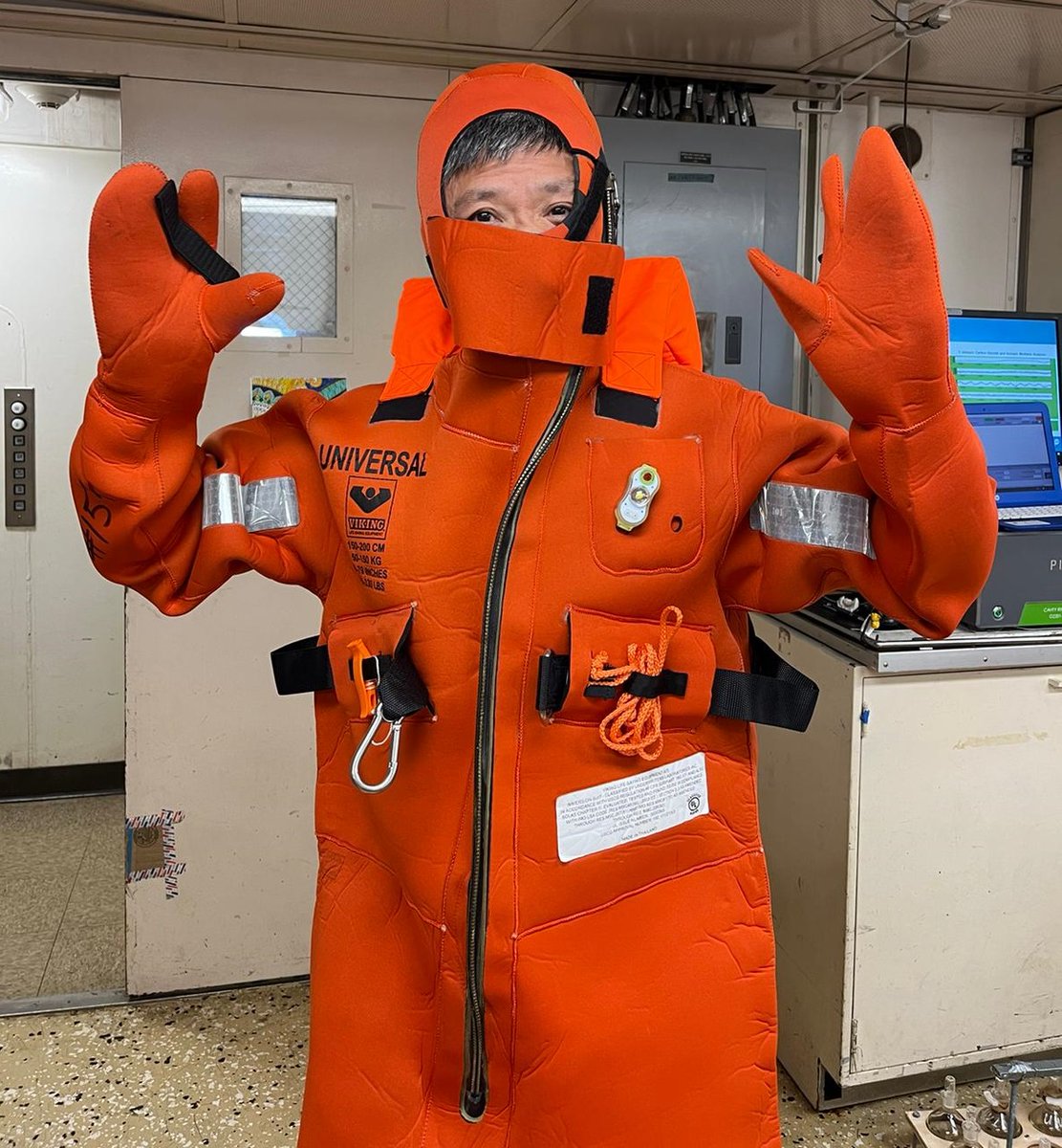 OA_NOAA's tweet photo. Chief Scientist for #ECOA3 Leg 2, Dr. Wei-Jun Cai from @udceoe, leads the way by donning his survival suit as part of the science crew's training aboard NOAA Ship Ronald H. Brown. Just in time with Hurricane Earl in the region bringing bigger seas. 

#SafetyFirst #ScienceAtSea https://t.co/CLbdqvo4sX