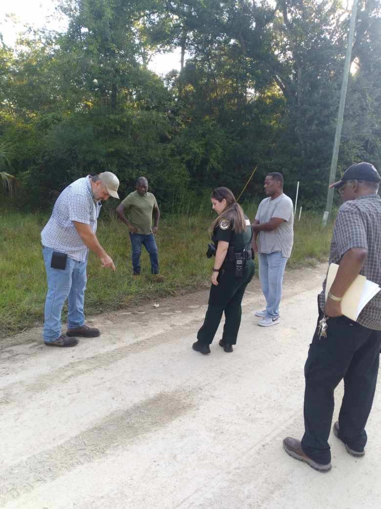 I and my son were nearly killed in Rosewood, Florida yesterday by a racist using his truck as he screamed racial insults. I was visiting my property, the only black-owned land in Rosewood. Here the Levy County police examine the scene. I reported it to the FBI as a hate crime.