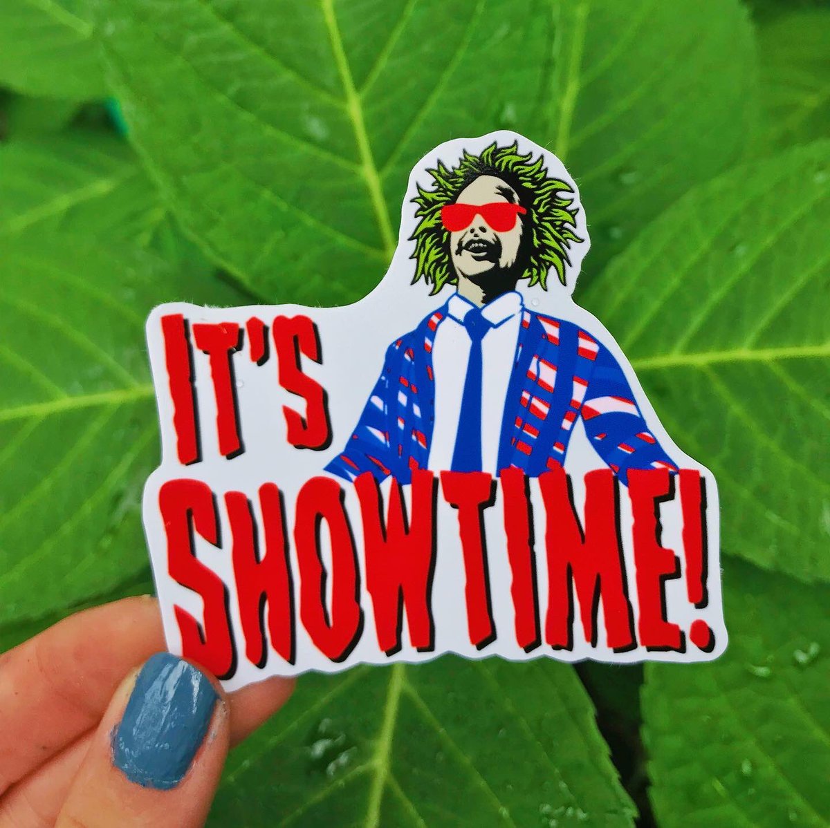 capra_co's tweet photo. Go figure it rains as soon as I start taking product photos.. good thing my stickers are weather resistant! 🤪

Revamped the whoop ass can since Etsy took it down AGAIN and added this new spooky gameday design 

both sticker &amp; mags available in the shop — link in bio! https://t.co/XuXPPgRttn