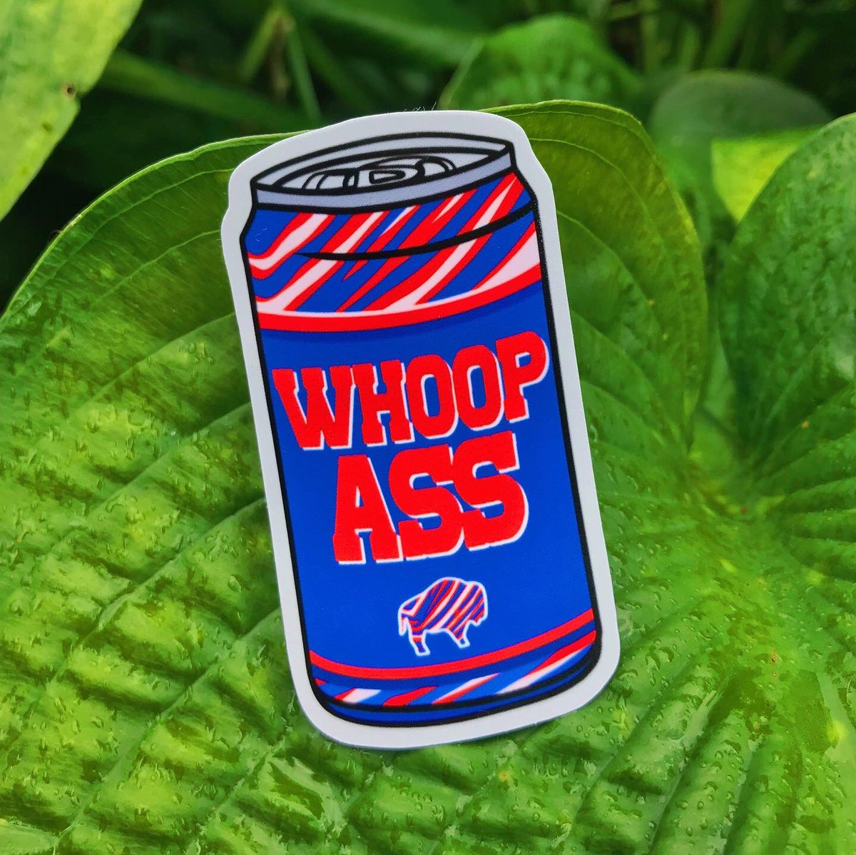 capra_co's tweet photo. Go figure it rains as soon as I start taking product photos.. good thing my stickers are weather resistant! 🤪

Revamped the whoop ass can since Etsy took it down AGAIN and added this new spooky gameday design 

both sticker &amp; mags available in the shop — link in bio! https://t.co/XuXPPgRttn