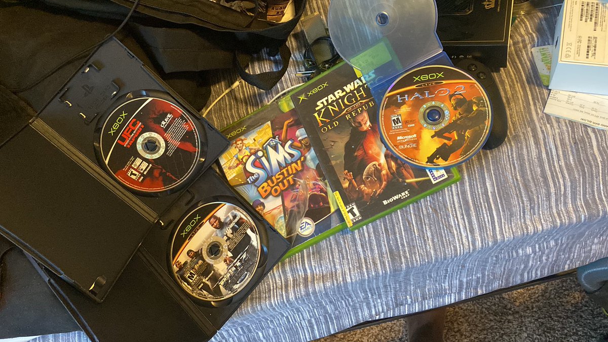 EyeBeVital's tweet photo. While packing up for this move look what I found ๐ฎโ๐จ #OG for real only the real ones know ๐คฃ๐คฃ #Halo2 #SimsBustinOut #StarWarsKOR #UFCTapOut #NFLBlitz https://t.co/F78gs707vh