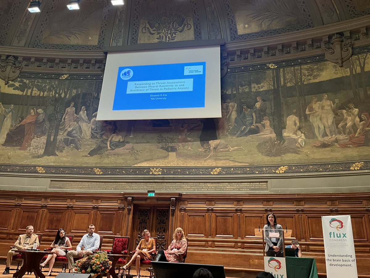 <a href="/ElizabethRKitt/">Elizabeth Kitt</a> from <a href="/dylanggee/">Dylan Gee, PhD</a>’s lab delivering a beautiful flash talk (in this lovely auditorium) at #Flux2022 in Paris on neural reactivity to and avoidance of threat in child anxiety!