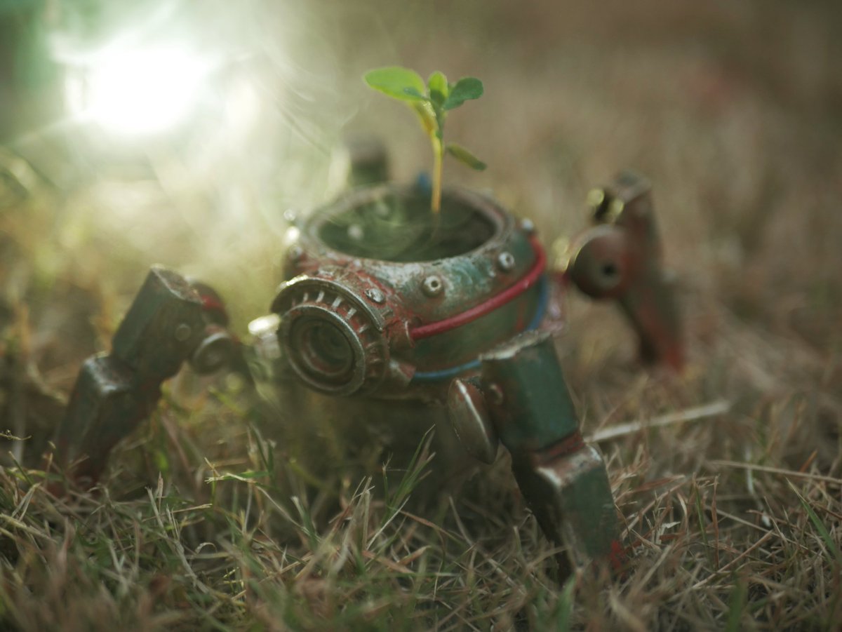 made this tiny flower pot bot with a cap and two clothespins