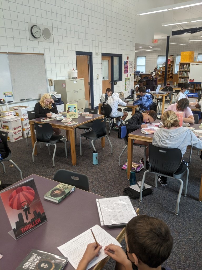 ELA students spend time exploring genre stations to construct a list of high-interest books for independent and partner reading.