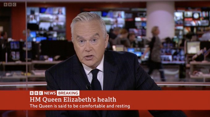 Huw Edwards wearing black tie on BBC One.