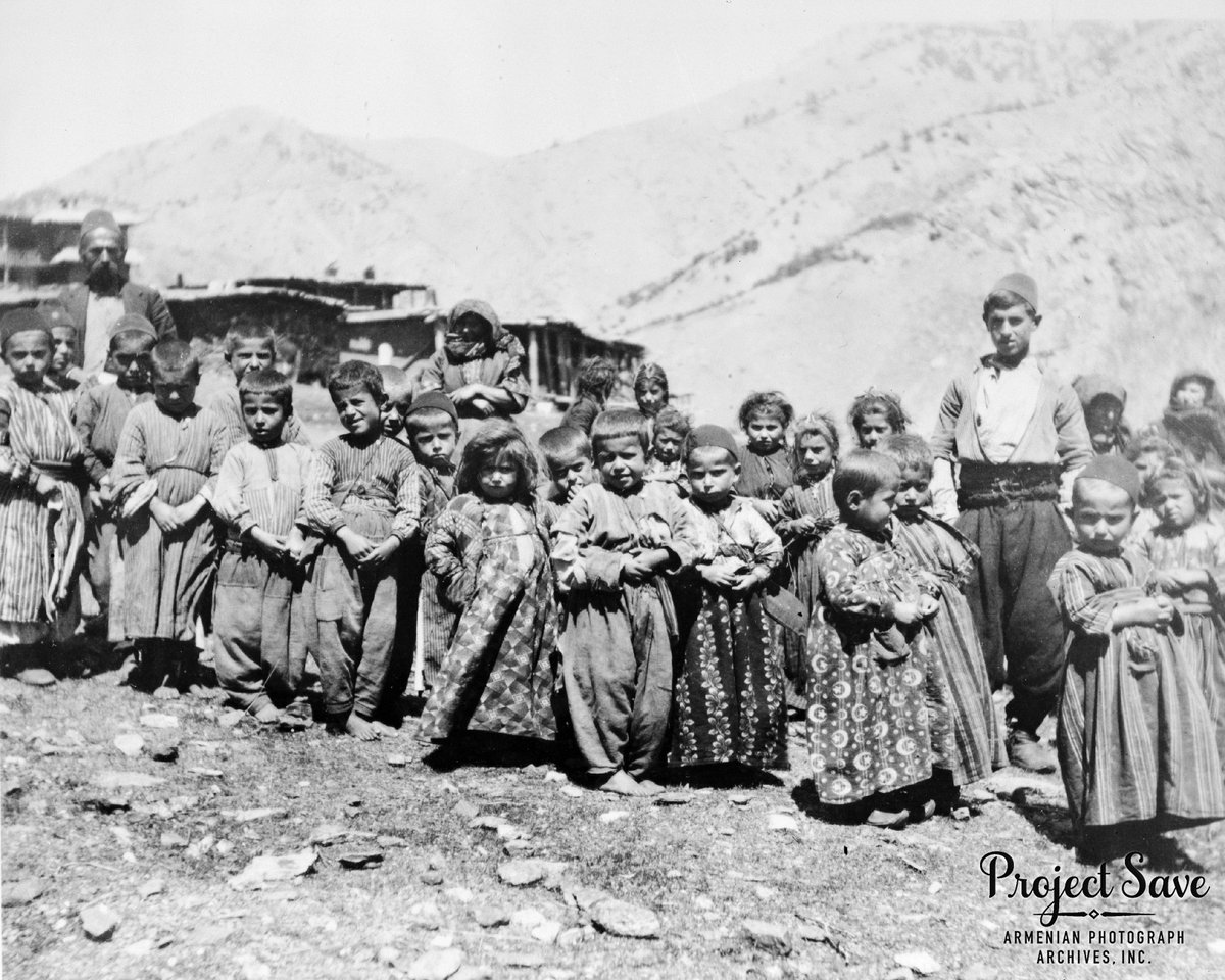 Village children wearing traditional garments, Zeitun, Ottoman Empire, c. 1900. Both boys and girls wear long, loosely belted garments made of hand loomed fabric, over which some of the boys wear shalvar (traditional pants). 

#ProjectSAVE #1900 #OttomanEmpire