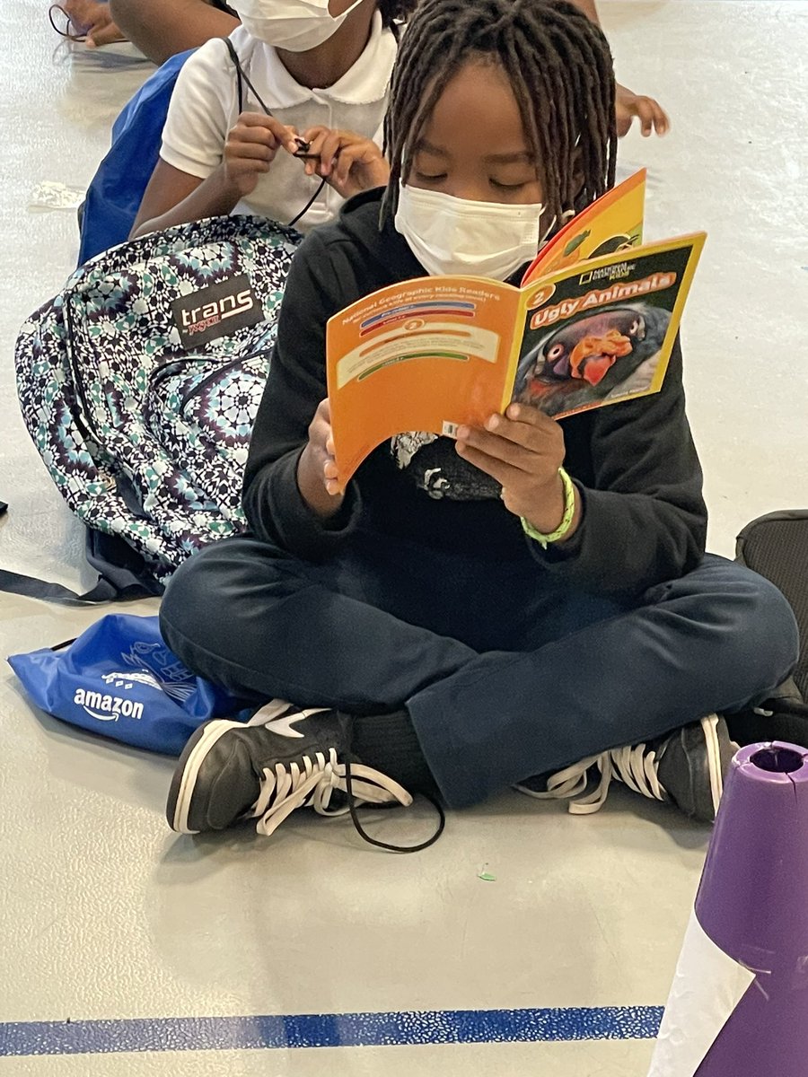 Andrea_N_edu's tweet photo. Reading happening all the time. Even during dismissal!! #SlaterUnited @SlaterPBSA https://t.co/mKkL2Zau7o
