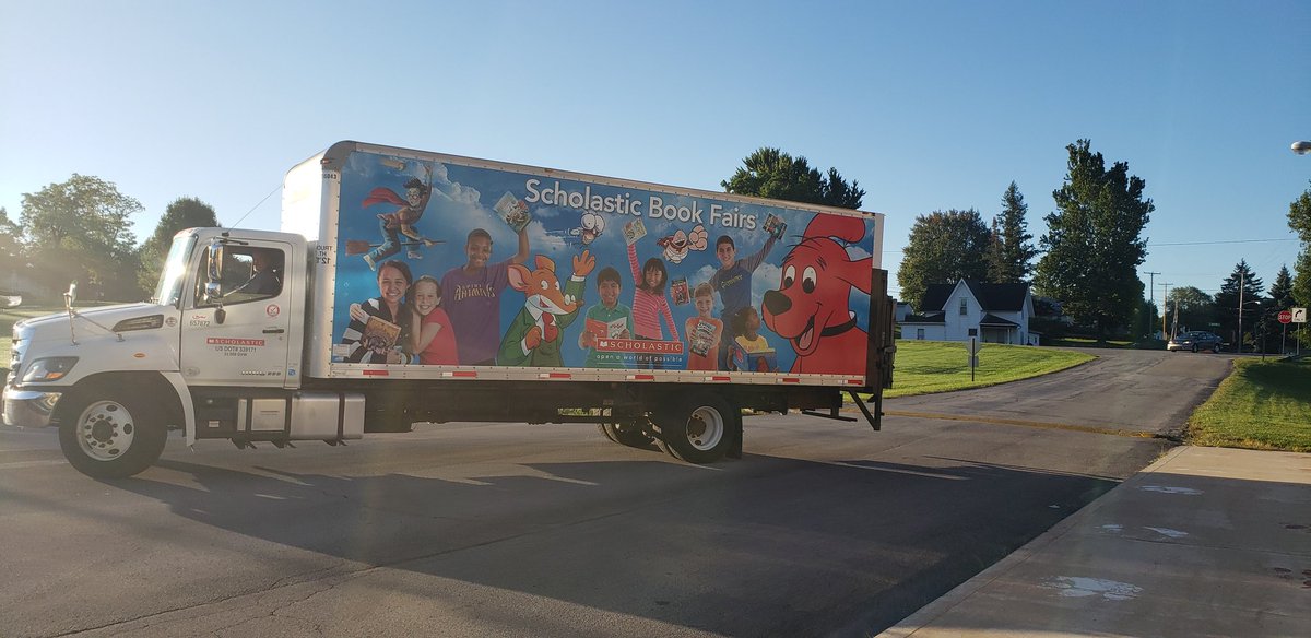 cne_library's tweet photo. The truck adorned with the big red dog arrived at CNE this morning and the book fair will soon be ready!!!@CNPrincipal https://t.co/X8haMVZuJj