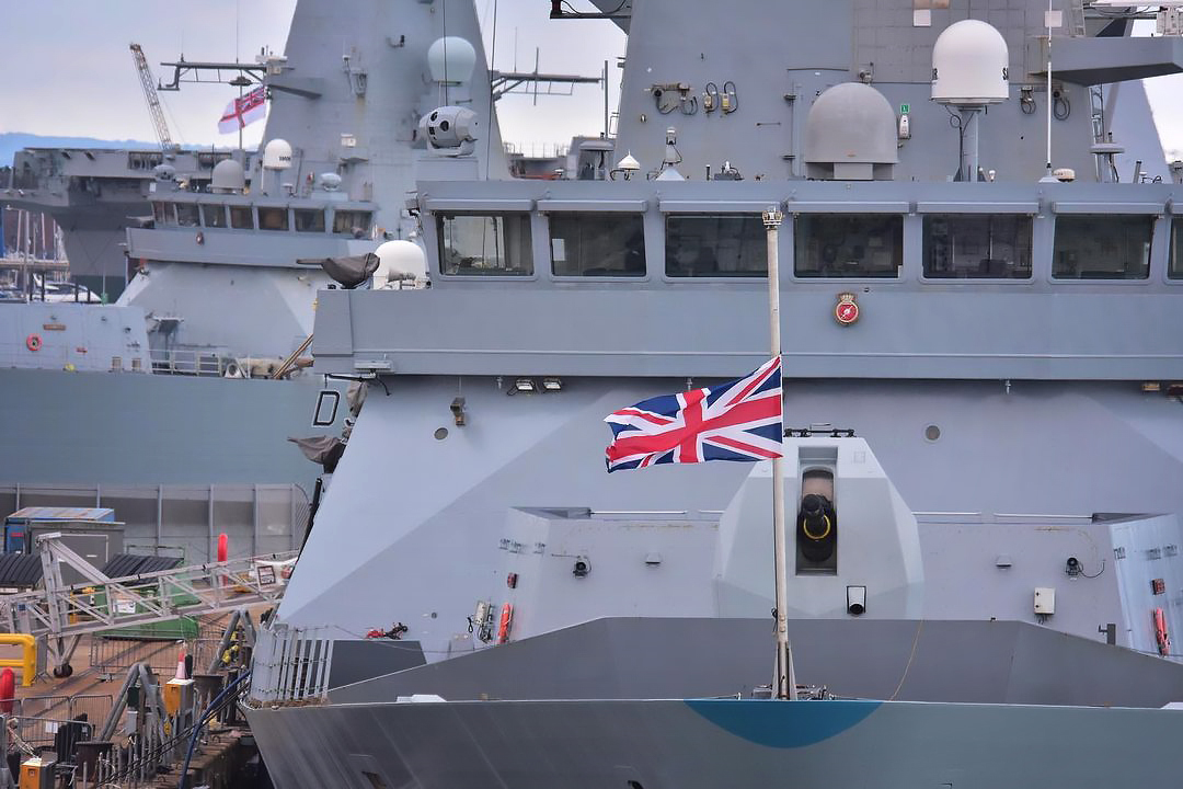 NavyLookout's tweet photo. .@HMSDefender in Portsmouth today. 

Jacks and ensigns flown at half mast by all commissioned RN vessels in mourning for the passing of Her Majesty.
#QueenElizabethII

Via @KielDolphin https://t.co/VpMKzkpZbg
