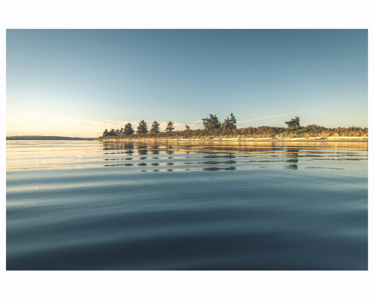 Looking across to islands in the sun off Vancouver Island.