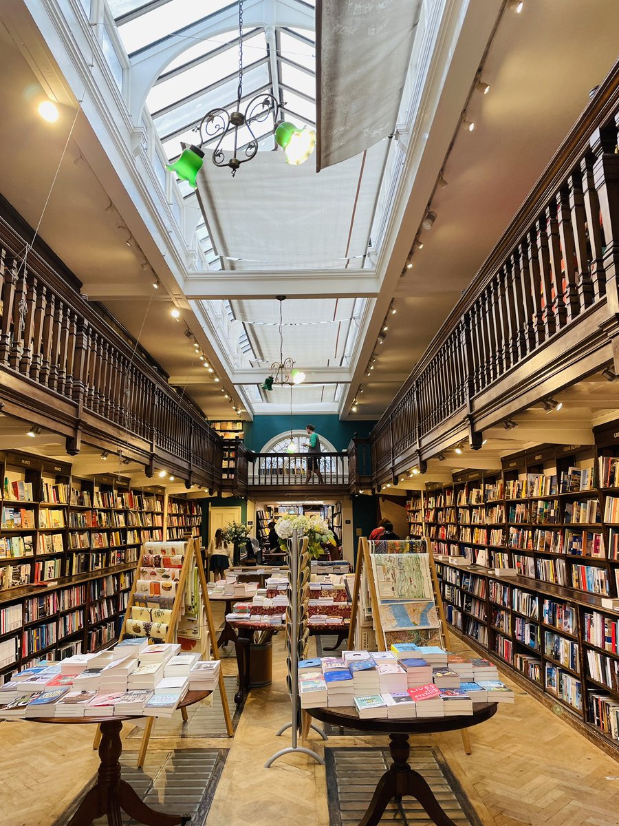 ZahirraD's tweet photo. Feels like your garden variety bookshop when you first step in, but it is very far from it. All that wood and the incredible silence. And those windows! Finally, I love that they recognise Africa is not a country. All the regions of the continent are well-represented 💜 #daunt https://t.co/FalaKKeNCT