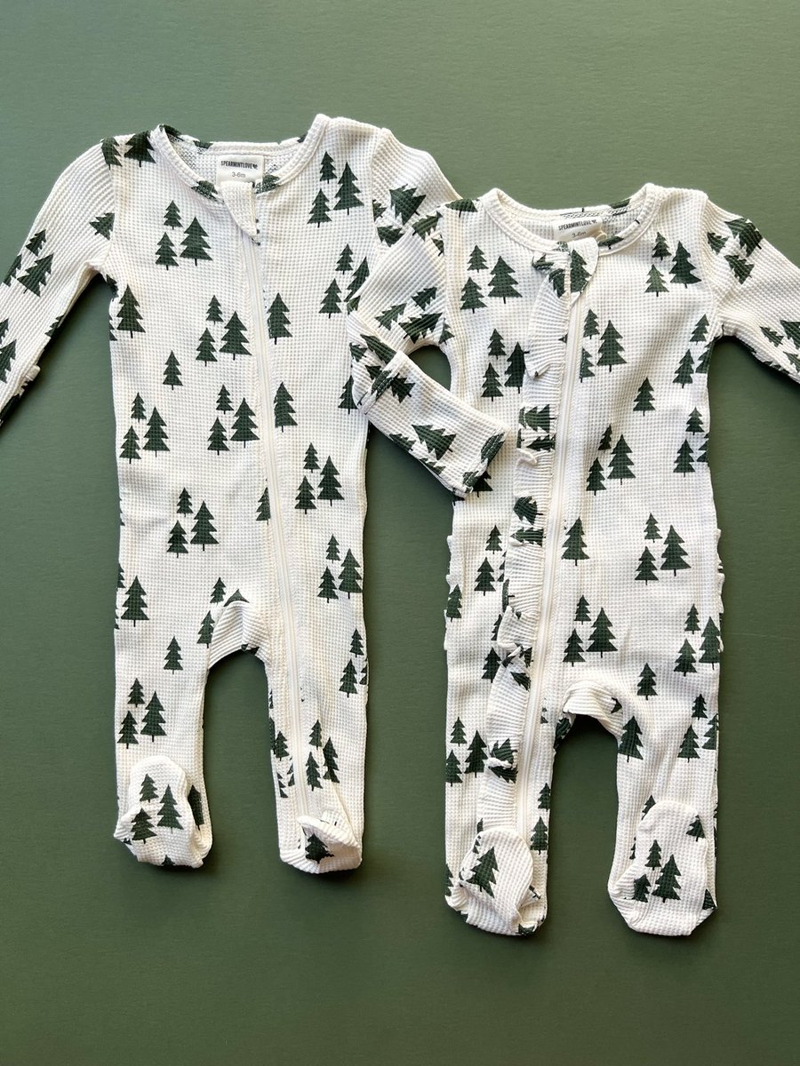 I absolutely love the versatility of these Forest Green Trees zipper footies! Basic for a boy and ruffles for a girl. Or basic for a girl with a cute bow. The options are endless!!

We also have a few two-piece sets left for the bigger kiddos! Sizes 12-18 and 18-24 months!