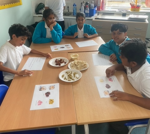 BJ_Year5's tweet photo. Year 5 enjoyed their immersion morning today where they delved straight into an exploration of their new topic: the Golden Age of Islam! This involved activities such as food tasting, Islamic geometric art and exploring Middle Eastern folk tales in the book Arabian Nights. https://t.co/akQA6WvnSQ