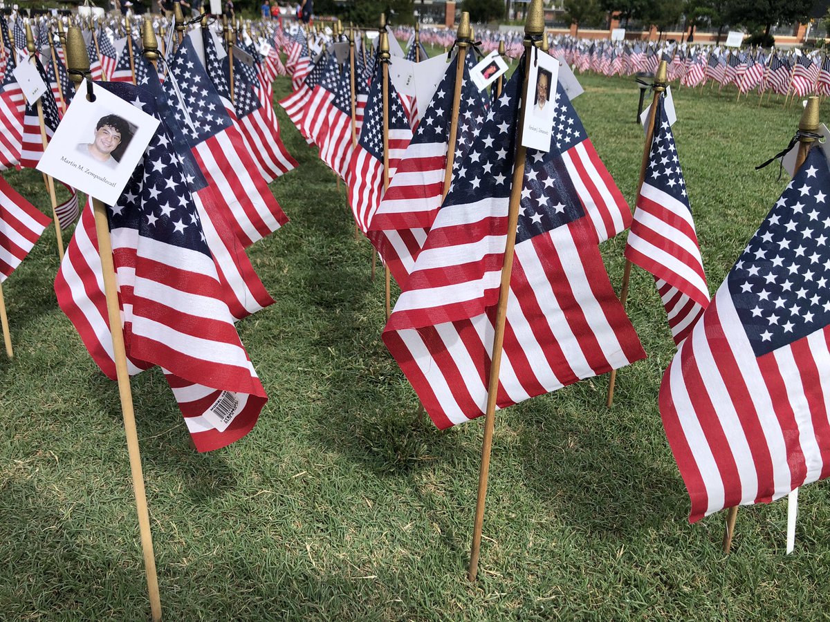 WCCBCharlotte's tweet photo. 2,977 American flags are in the ground at Romare Bearden Park, in the shape of the twin towers. Each will have the name and picture of a person lost that day. The #flagsofremembrance will be on display till Monday. #September11 https://t.co/1lM3SJXVB3