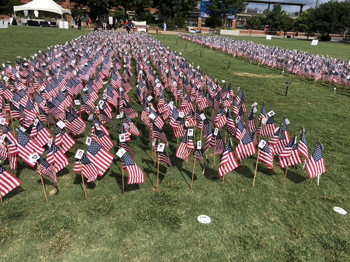 WCCBCharlotte's tweet photo. 2,977 American flags are in the ground at Romare Bearden Park, in the shape of the twin towers. Each will have the name and picture of a person lost that day. The #flagsofremembrance will be on display till Monday. #September11 https://t.co/1lM3SJXVB3