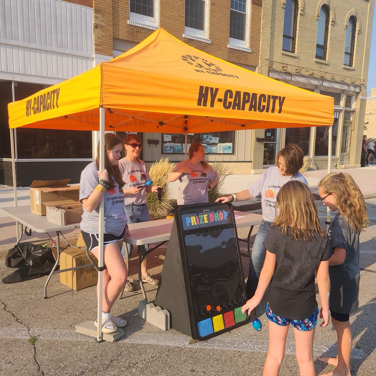 HyCapacity's tweet photo. Thank you to everyone who stopped by our tent at the CyHawk event last night, we had a great time playing plinko with you! #CyHawkRivalry #ATownDivided https://t.co/ScwBquTW0a