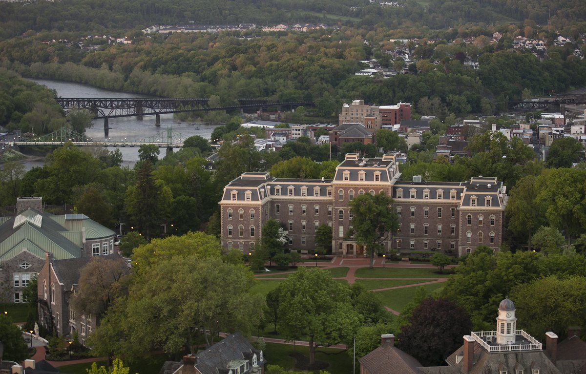 Aerial view of Pardee Hall, campus, a bridge, and Easton.