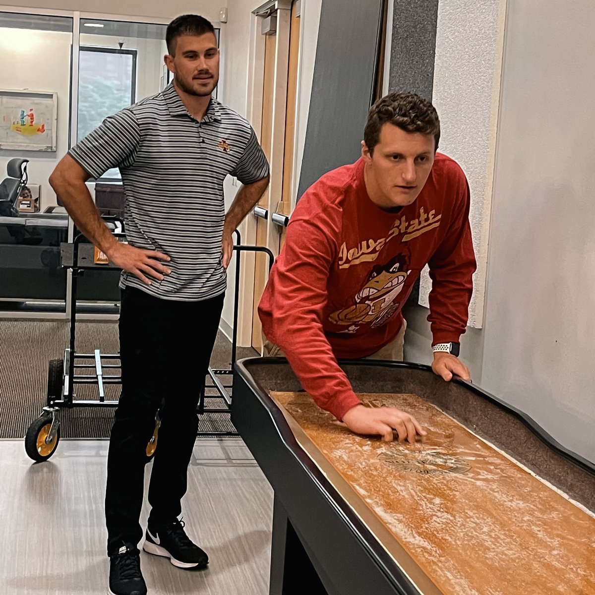 Trilix's tweet photo. An agency divided! The Trilix crew came together to celebrate the state’s most polarizing event — the Iowa vs. Iowa State football game. 🏈 #CyHawkGame https://t.co/PXjNLgH4a9
