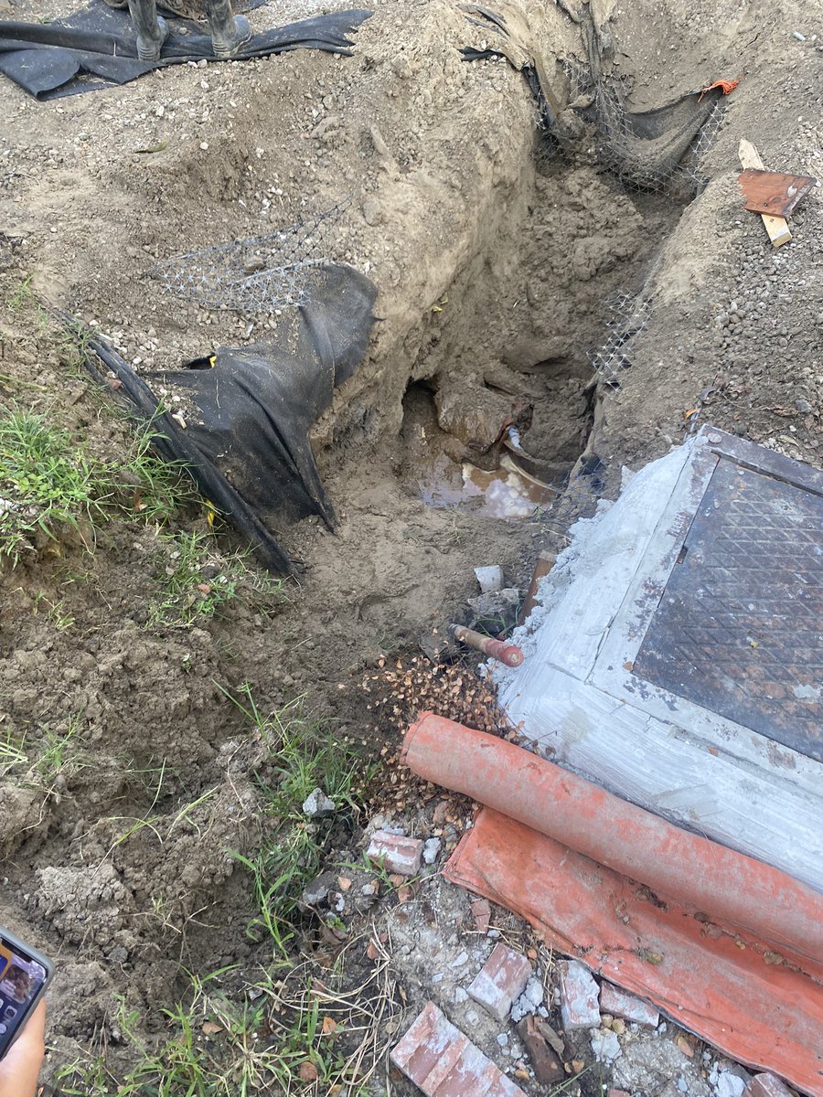 MerlinPhoto's tweet image. We were so close to having a street. So close!! Hairline fracture in the 100 yr old pipe that the city chose NOT to replace runs down the whole block. The newly poured concrete will have to be torn up, pipe replaced and new concrete put down.  Why?!! #nola #infrastructureproblems