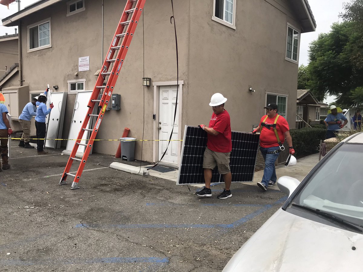 JosieTalavera's tweet photo. It’s a hot day in SoCal but that didn’t stop our @WellsFargo #volunteers who worked hand in hand with @GRID installing solar panels. Thanks #Westminster Mayor TA for coming out today! @WestminsterPIO #welcomehome https://t.co/W0qbGmFPqY