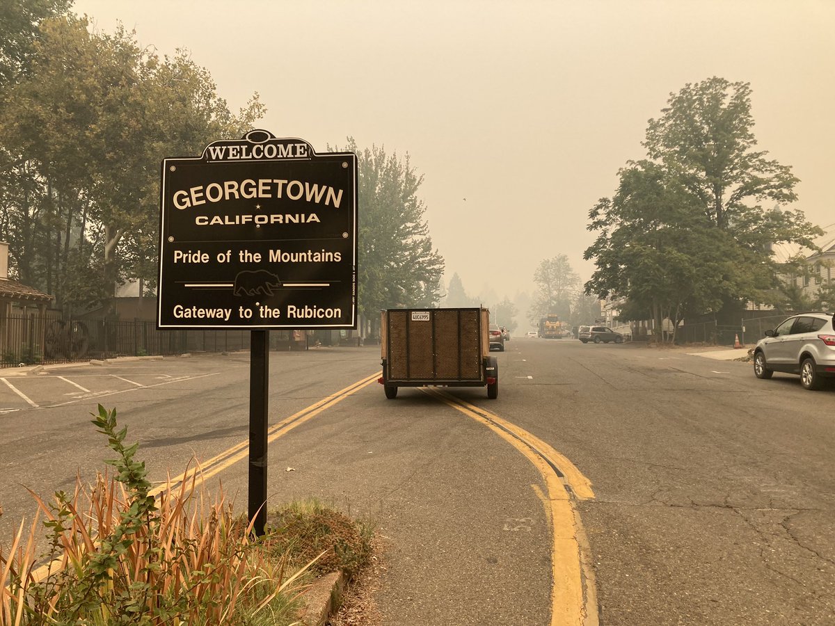 kurtriveratv's tweet photo. View of Georgetown right now under mandatory evacuation orders. Thick smoke and poor visibility. Some are staying in place as long as they can. ABC10 #MosquitoFire https://t.co/rJFieO8JXX