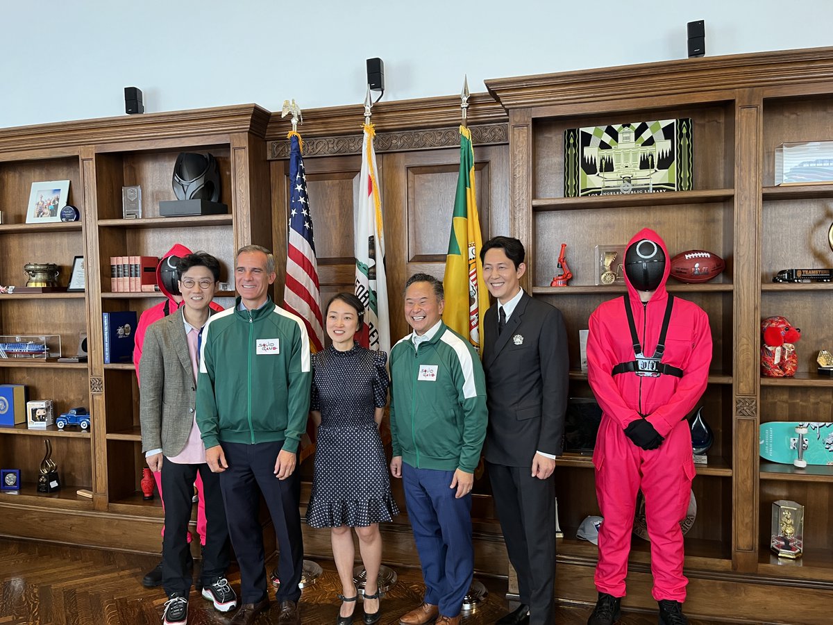 squidgame's tweet photo. Lead actor Lee Jung-jae and creator-writer-director Hwang Dong-hyuk join @MayorOfLA  and Council Member John Lee at @LACity  Hall to celebrate the passing of the Squid Game Day Resolution. https://t.co/inretWYN8q