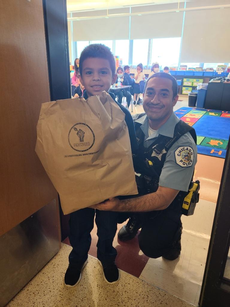 CPD_CST's tweet photo. This afternoon officers from the Citywide Community Safety Team distributed pantry bags containing nonperishable food items donated by @Fight2Feed to students at Calmeca Academy. https://t.co/2XSiNruM12