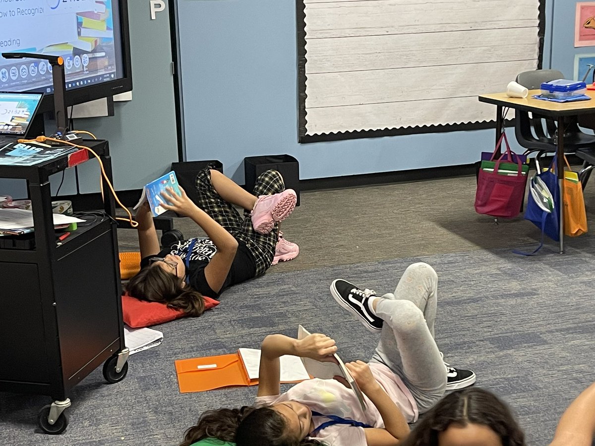 castro_teaches's tweet photo. Small groups and rotations- I think I’m getting the hang of this! Flexible seating for independent reading today; determining genre in small groups. #read180rara #5th_is_lit #bilingualeducation https://t.co/tHibJHeLnh