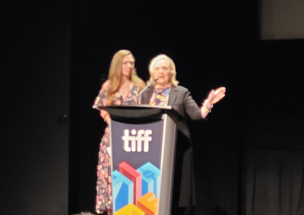 POVmagazine's tweet photo. Hillary Clinton and Chelsea Clinton introduce IN HER HANDS, which got a huge standing ovation 👏 #tiff22 #tiffdocs #inherhands https://t.co/41g01xbz6u