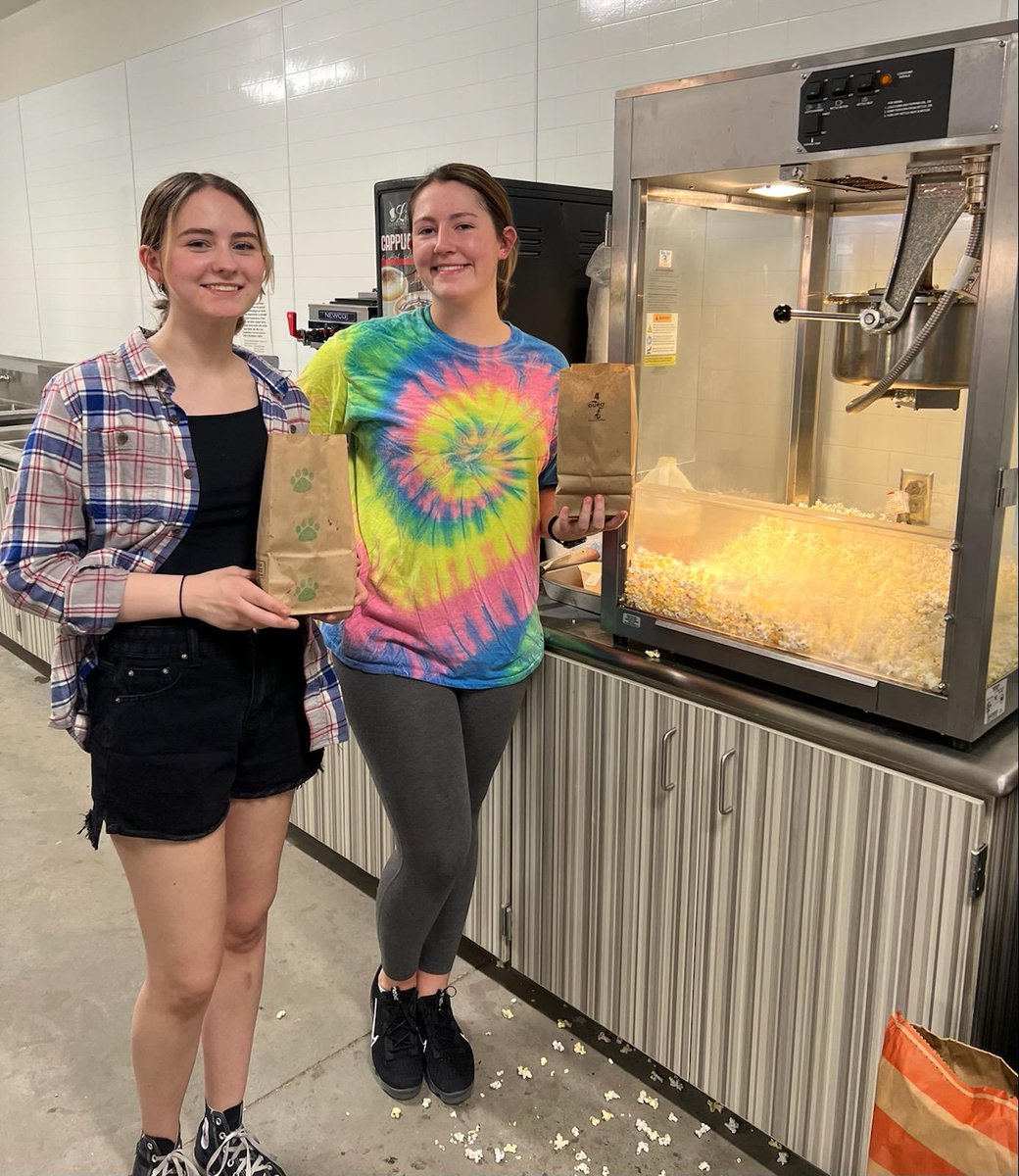 SHSS_NHS's tweet photo. NHS enjoying a night of @SalinaFootball making popcorn in the concession stand. Shout-out to South High FLC for the bag decorations! #COUGS #305GrowsGreatness https://t.co/9WoqsvaFWQ
