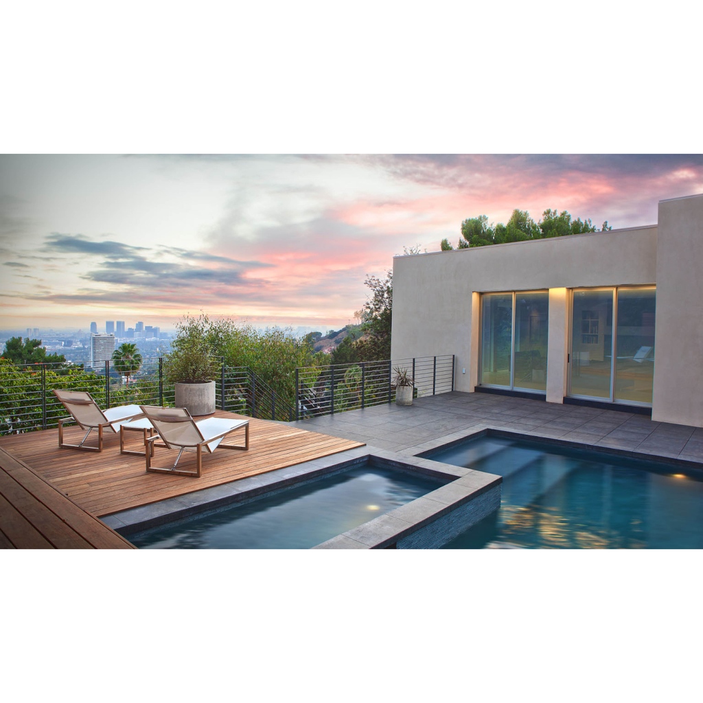 This #DohenyDrive Los Angeles renovation updates the home with crisp lines and a clean white finish. The backyard was transformed into an oasis with a pool, hot tub, and plenty of space to soak up the sun and views beyond. 

Year: 2022

#auxarchitecture #homerenovation