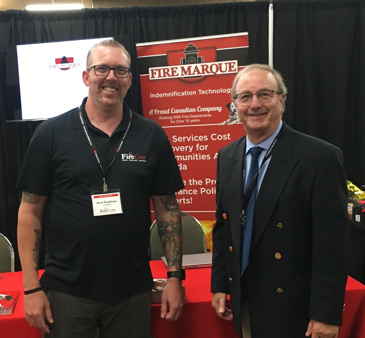 MarqueFire's tweet image. Pleased to have Fire Con President Kent Readman drop by Fire Marque booth and meet with Fire Marque  President Ted Woods. #FireCon  @ONFireChiefs