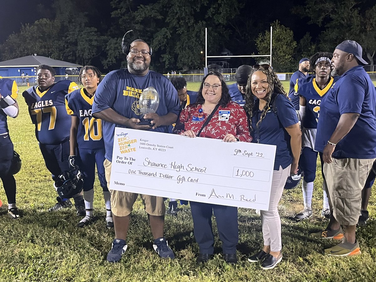 Coach Vernon Gibson Jr. and <a href="/ShawneeEagles2/">Shawnee Football</a> Principal Kymberly Rice with the <a href="/kroger/">Kroger</a> KSR Hometown Classic Trophy