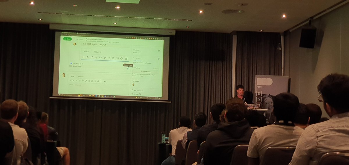 MishManners's tweet photo. We have @damovisa talking about GitHub Codespaces and Actions while tackling AV issues like an absolute boss. Good thing Codespaces works on any laptop!

Damo does lots of speaking poses so great time to get those #DDDperth bingo pics. https://t.co/RQR4xawJnO