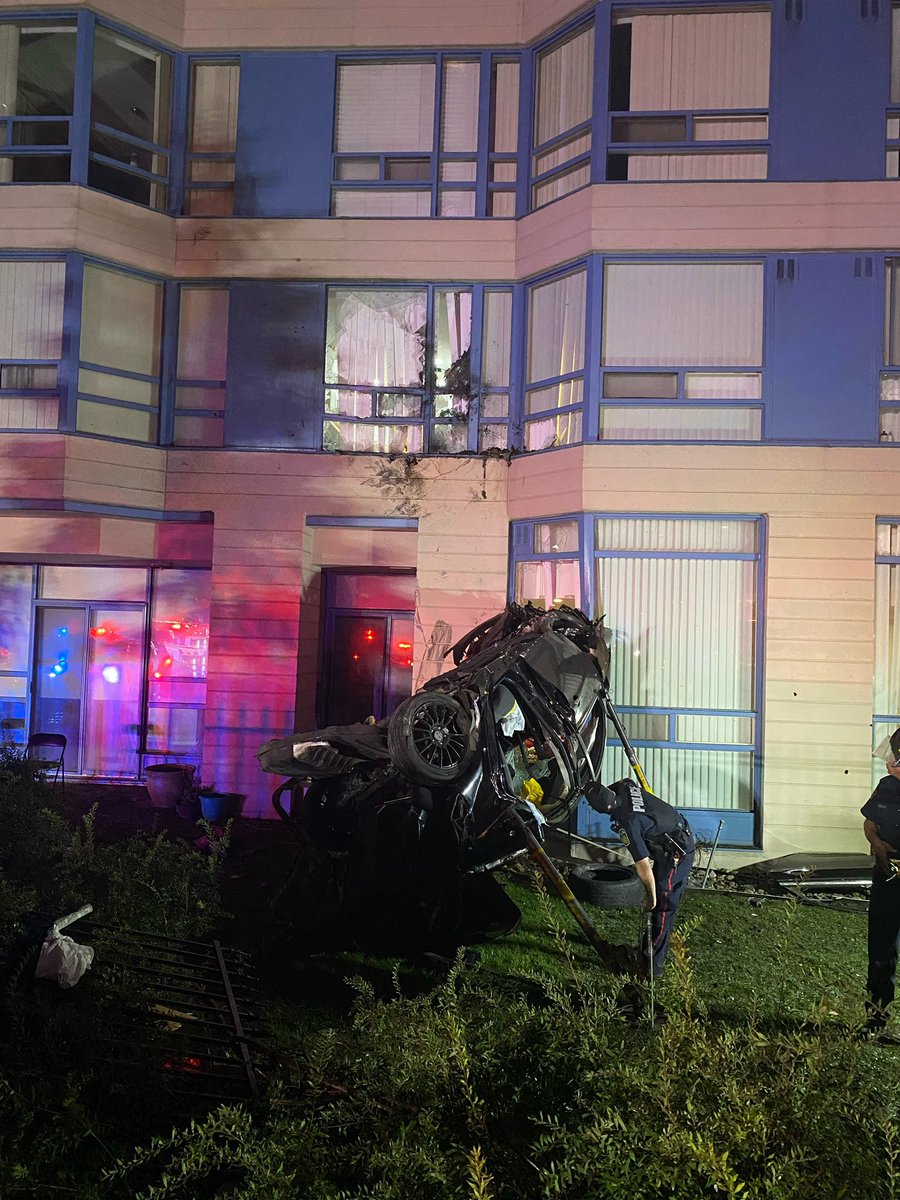 MississaugaFES's tweet photo. MVC this morning. Car into an apartment building at 250 Webb Dr. Car hit window on 2nd floor, possible damage up to the 4th. 

Driver extricated. 

Building inspector requested to assess building. https://t.co/WMRv3aZafD