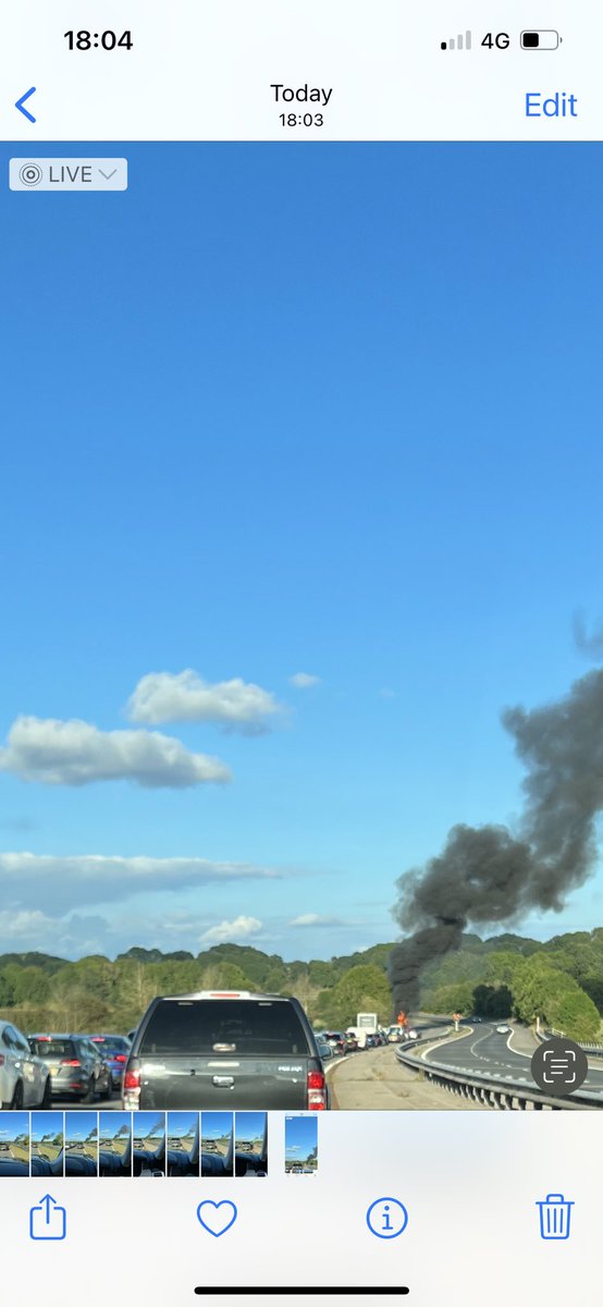FearStephen's tweet photo. Car on fire M48 going east from #Magor services to #Chepstow. Huge line of traffic so avoid if possible. Emergency services are on site so it looks under control from what I can see.  #Wales https://t.co/1H9uRM5Wg0