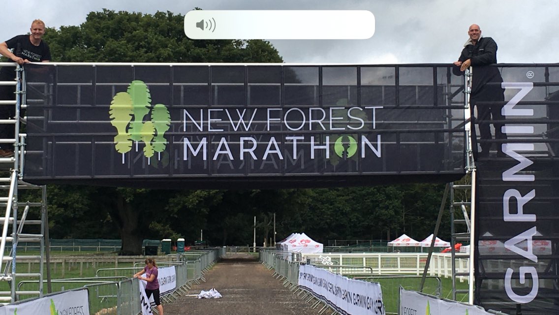 JonVamplew's tweet photo. Wow! The new New Forest Finnish line gantry, Chris and Andy the Director’s introducing us to it.@NFMarathon @GarminUK https://t.co/KFJ9I1FqhT