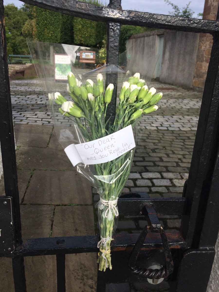 A rather lovely floral tribute to Her Majesty tied to the Garden gate.