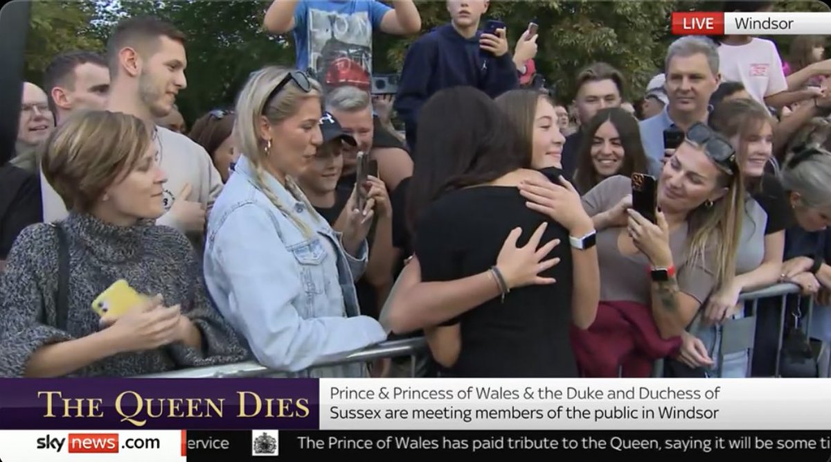 thepopcornreel's tweet photo. A woman in the crowd outside Windsor Castle hugs Meghan Markle, the Duchess of Sussex. A nice moment. https://t.co/MpwtSqgmeT