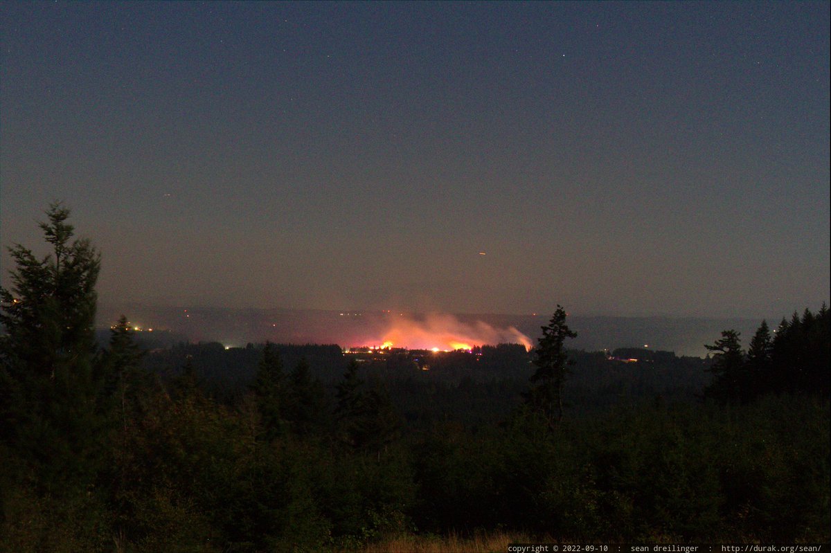 RadRachelLove's tweet photo. My husband Sean Dreilinger @sed was able to take some much better photos using a real camera last night. Here are some shots of the #McIver fire in Estacada from our back deck in Beavercreek, OR about 3 miles away. Thank you SO MUCH to @clackamasfire for containing this!!! 🔥🔥🔥 https://t.co/fFePlJ4E29
