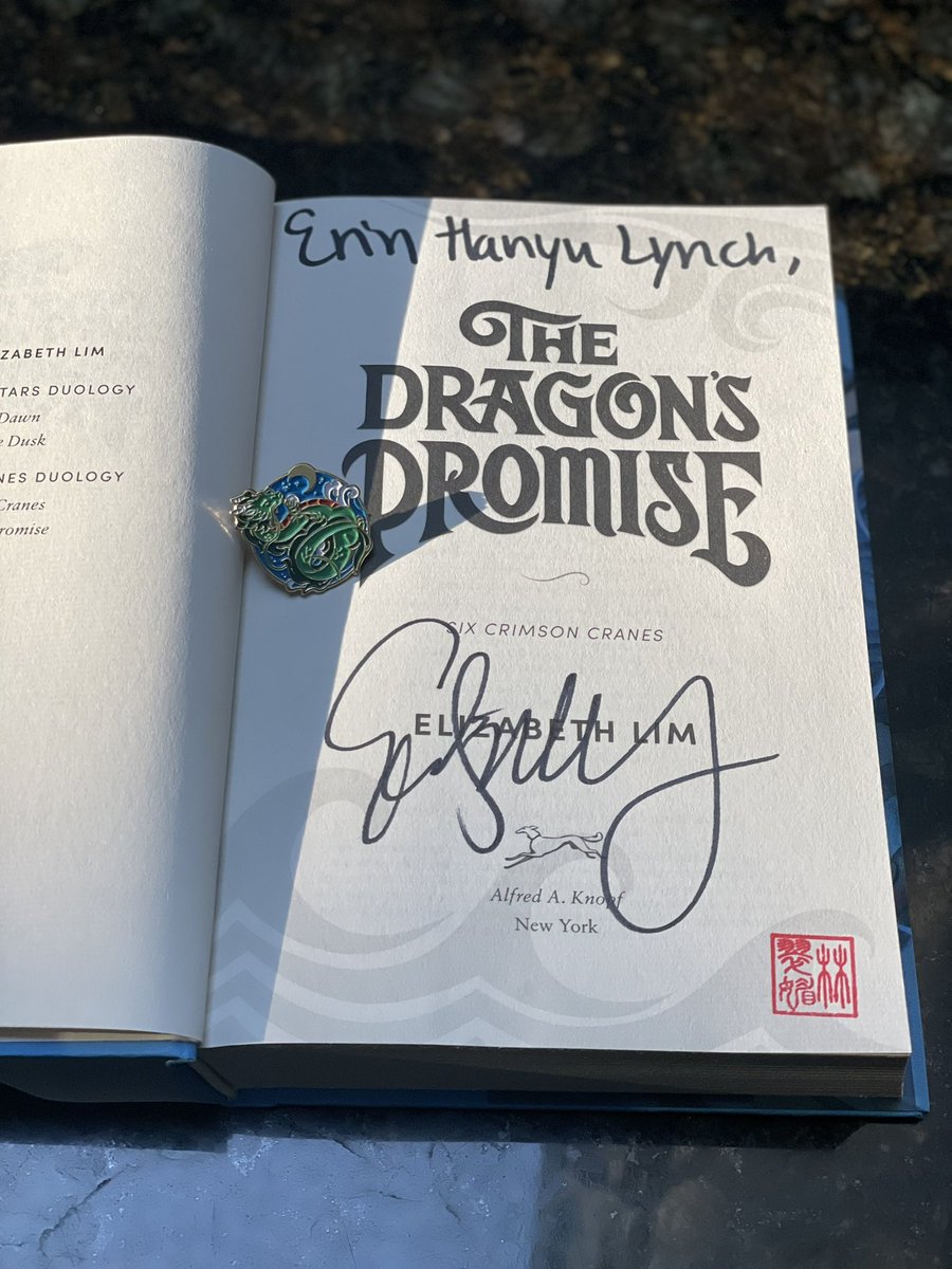 My copy of The Dragon’s Promise + preorder pin just arrived, and it is GORGEOUS 😭😭😭