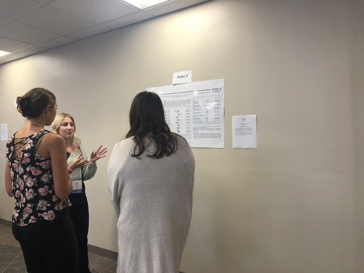 Attendees engaging with poster presenters Saturday afternoon during <a href="/uticauniversity/">Utica University</a> conference on community health and healing