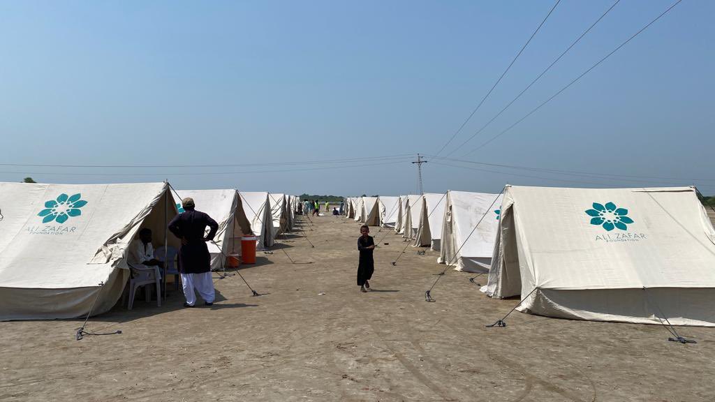 AliZafarsays's tweet photo. Our team has reached one of the most affected areas in interior Sindh. What they tell me is heart-wrenching. Scorching heat with no roof or clean water besides countless other issues. We’ve started setting up the tents but so much more needs to be done. #PakistanFloods2022 https://t.co/y0rQjhL008