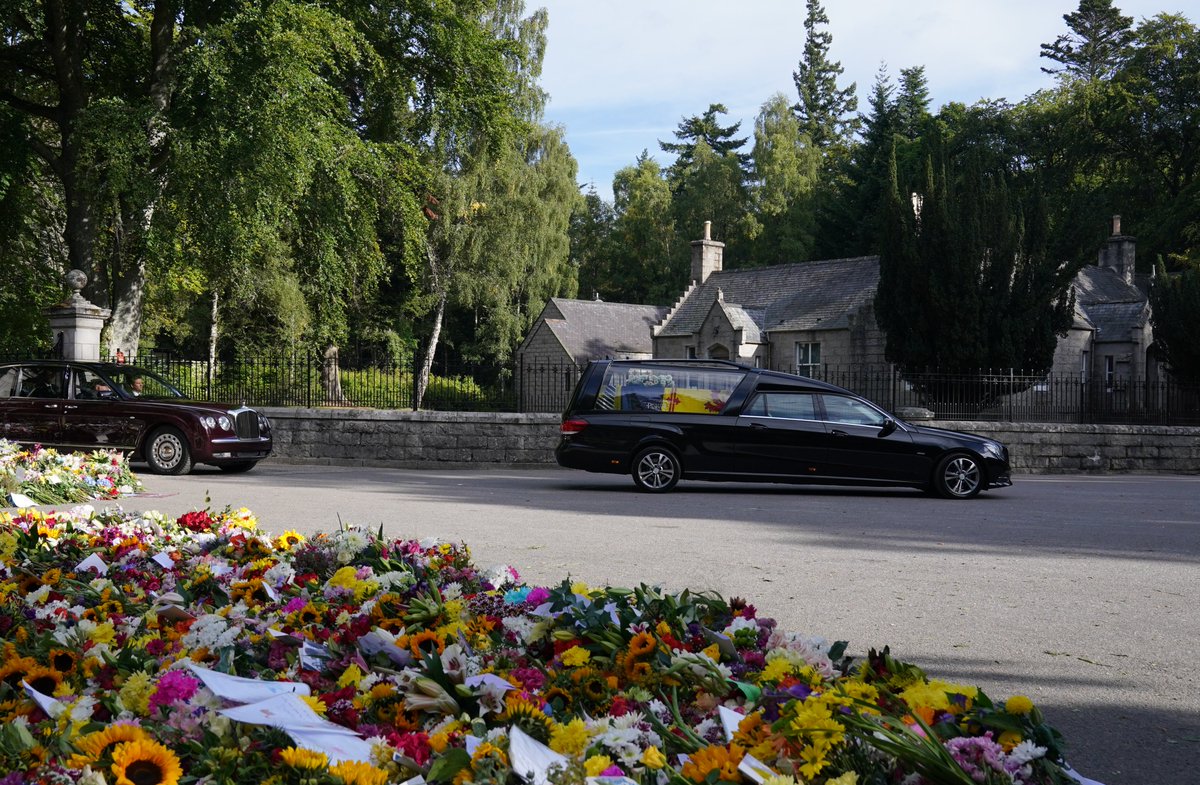 Her Majesty The Queen’s coffin has left Balmoral.

Accompanied by The Princess Royal and Sir Tim Laurence, the cortege will travel to the Palace of Holyroodhouse.

The Wreath on the coffin features Dhalias, Sweet Peas, Phlox, White Heather and Pine Fir from the Balmoral Estate.