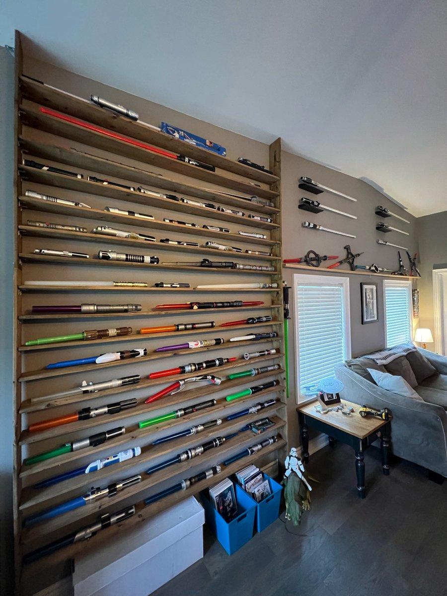 This is what 83 lightsabers looks like on my wall. And NOW I’m moved in. #lightsabers #starwars #anelegantweapon