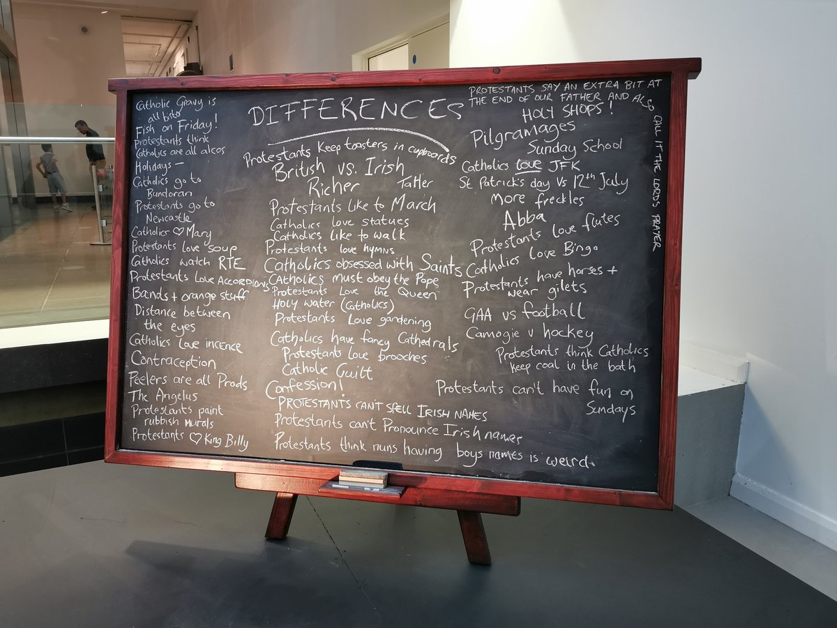 DrStuartJackson's tweet photo. Great mini exhibit in the @UlsterMuseum at the moment, the blackboard list lampooning differences between Roman Catholics and Protestants from the comedy series #DerryGirls. Literally laugh out loud stuff, especially in front of confused looking tourists. https://t.co/TCcQeu2nqX
